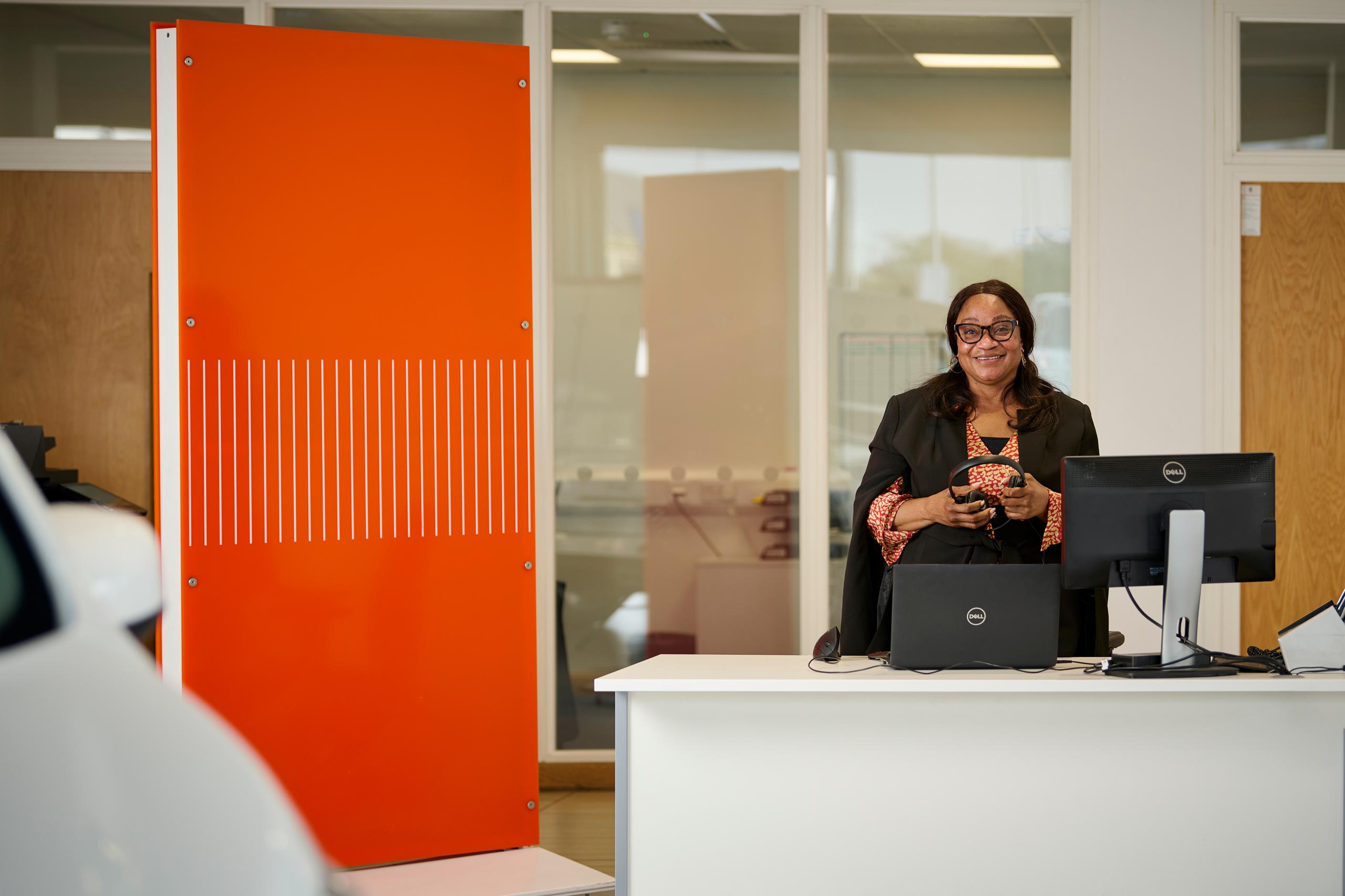 Woman at her desk in a showroom
