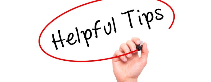 person writing helpful tips