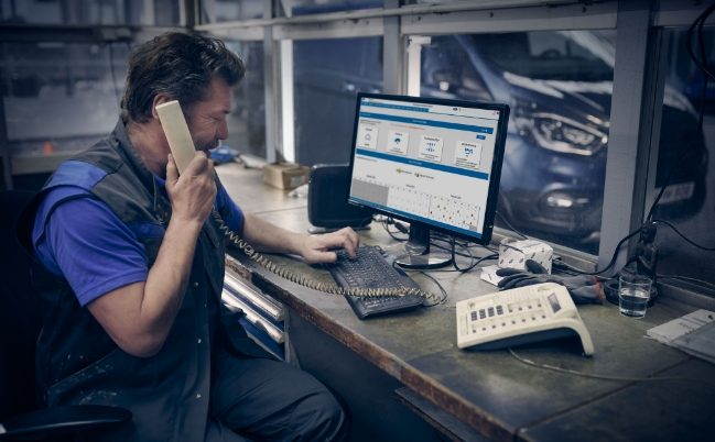 Man talking whilst on the computer